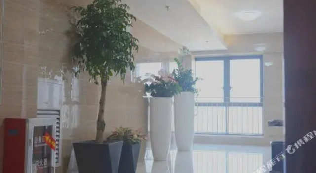 Кровать в общем номере Longxi Apartment