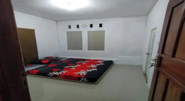 Номер Deluxe EXPRESS O 91702 Mandeh Homestay Syariah Near Bank Nagari PT Bank Pembangunan Daerah  Sumbar Cabang Painan