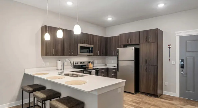 Апартаменты Deluxe CozySuites - Penrose