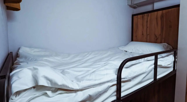 Cama em dormitório Aiva Hostel