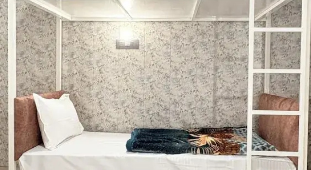 Кровать в общем номере Pinky Home Stay