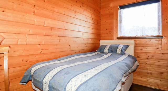 Mökki parvekkeella Maple Lodge