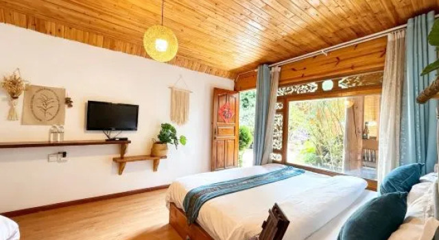 Кровать в общем номере Qiuniang House Lugu Lake