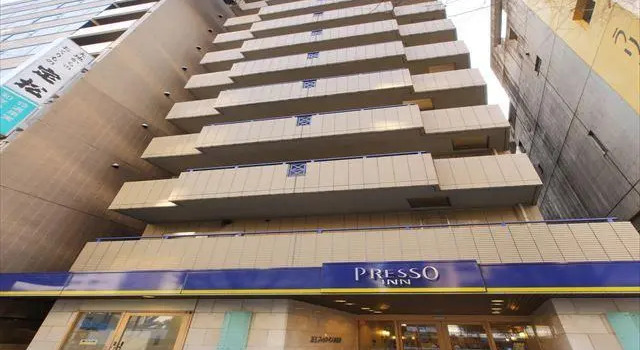Кровать в общем номере Keio Presso Inn Higashi-Ginza