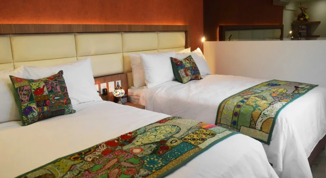 O podwyższonym standardzie czteroosobowy pokój Hotel Boutique Dawat WTC