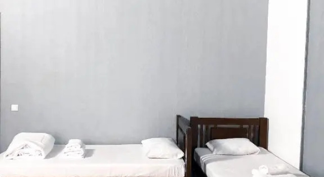 Кровать в общем номере Hotel Zipper House