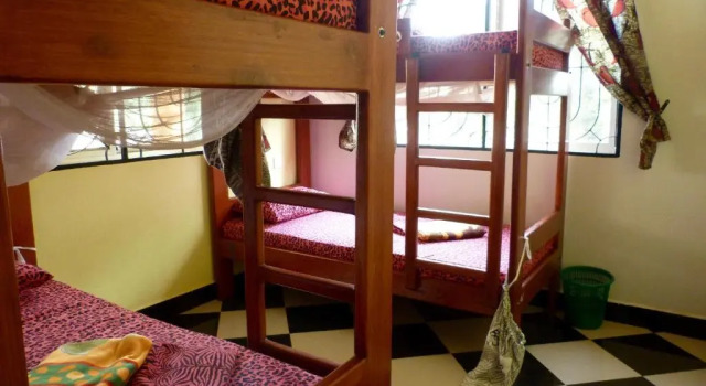 Łóżko w pokoju wieloosobowym Rafiki Backpackers & Guesthouse