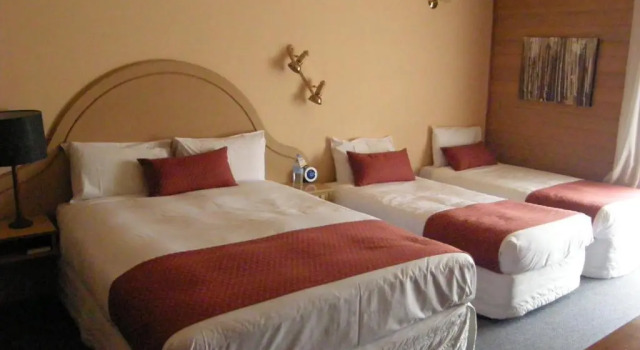 Deluxe quadruple chambre Quality Inn Colonial