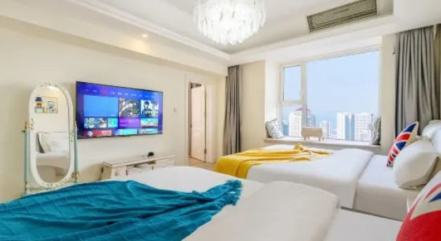 Кровать в общем номере Ganghui Four Seasons Hotel Apartment (Dalian Railway Station Zhongshan Square)