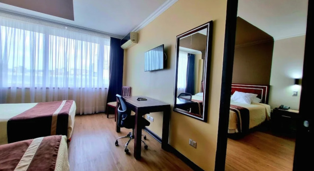 Кровать в общем номере Hotel El Araucano