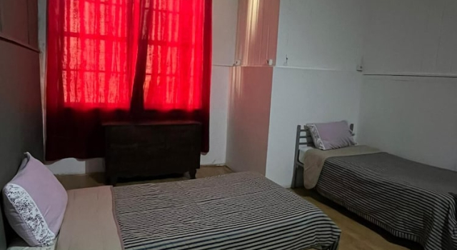 Кровать в общем номере Casa Augusta 2