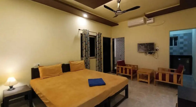 Vuode makuusalissa Madhu's Inn
