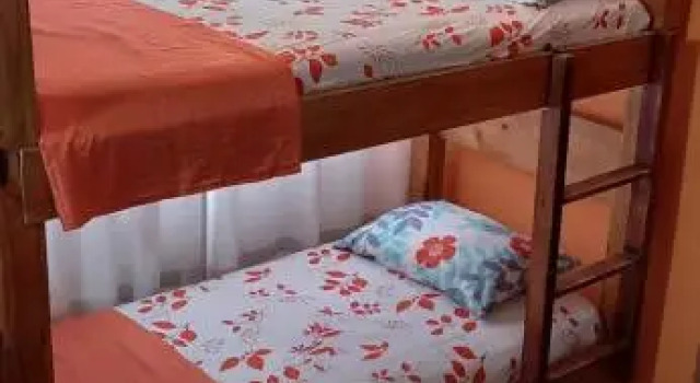 Кровать в общем номере Casa Italia Guest House