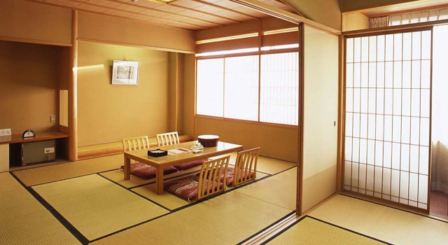 Кровать в общем номере Hotel Sakushu Musashi