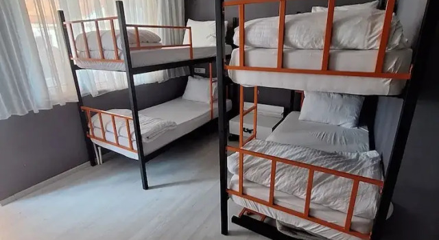 Кровать в общем номере Dilmac Hotel