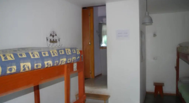 Кровать в общем номере Hostel Los Cormoranes
