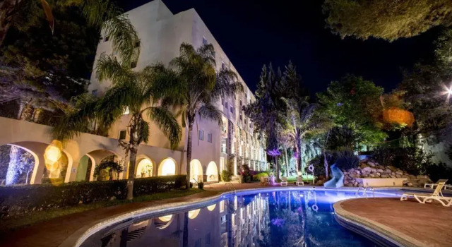 Кровать в общем номере Hotel Ex-Hacienda San Xavier