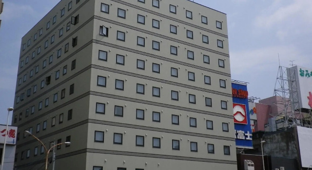 Кровать в общем номере Hotel Route-Inn Aomori Ekimae