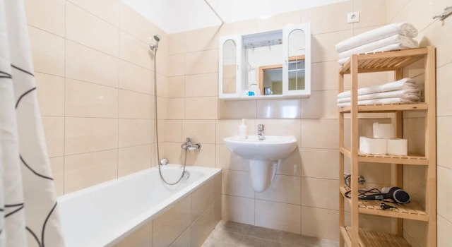 Кровать в общем номере с 2 комнатами Nova Apartments