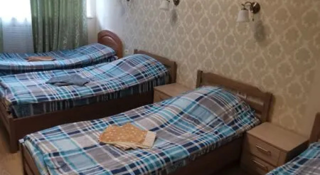 Кровать в общем номере Гармония