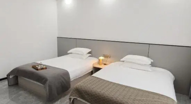Кровать в общем номере LAN YUE JU Hotel (Mount Longhu Visitor Center)