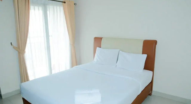 Simply Studio Room Atria Residence Apartment near Summarecon Mall By Travelio