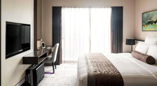 O podwyższonym standardzie dwuosobowy suite Pullman Zhuhai