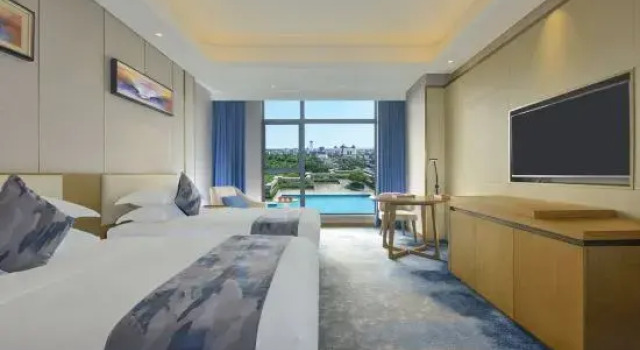 Номер Deluxe Ramada Plaza Dongxing City Center