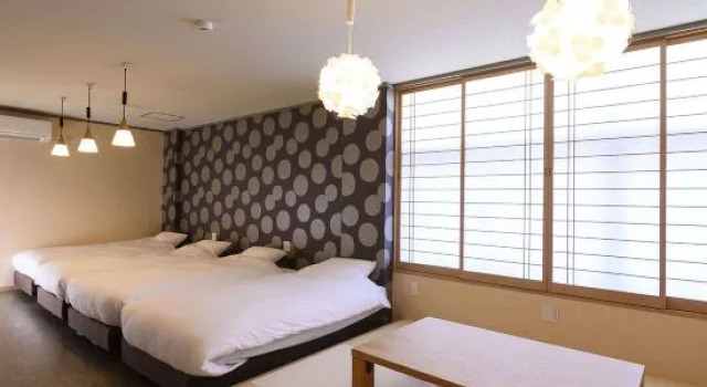 Кровать в общем номере BEYOND HOTEL Takayama 3rd