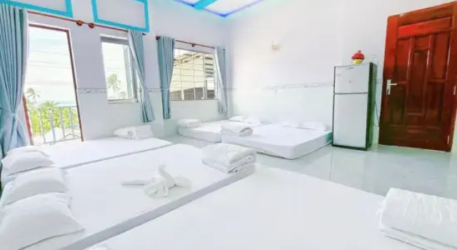Кровать в общем номере Quoc Dinh Guest House