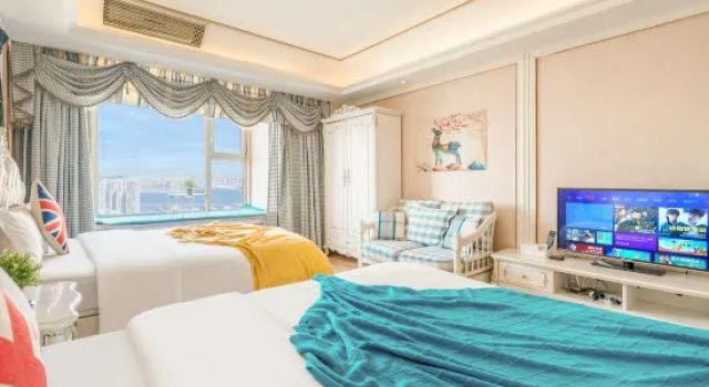 Кровать в общем номере Ganghui Four Seasons Hotel Apartment (Dalian Railway Station Zhongshan Square)