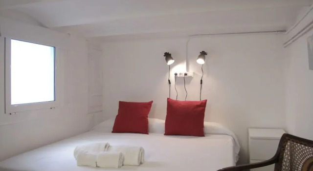 Кровать в общем номере с 6 комнатами с балконом My Address in Barcelona