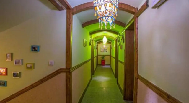 Кровать в общем номере Zhangjiajie April Day Hostel