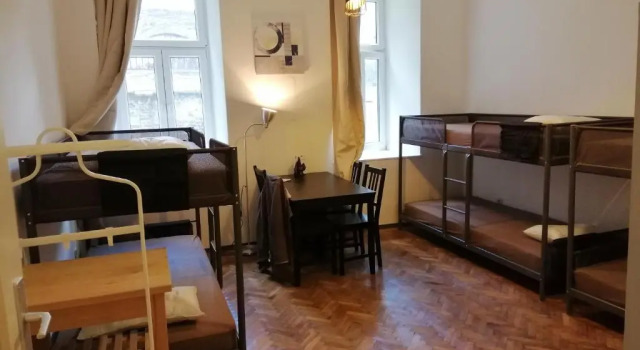 Кровать в общем номере Max Out Apartment