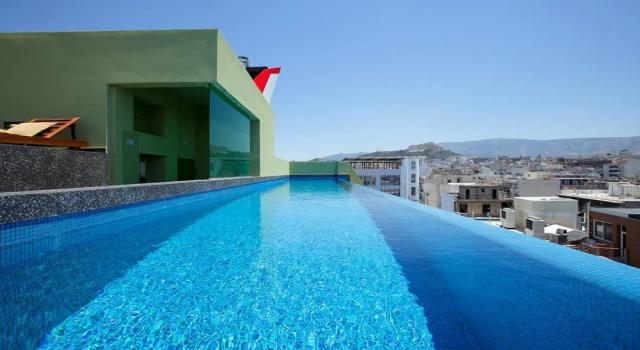 Кровать в общем номере с 2 комнатами Athens Mosaico Suites & Apartments