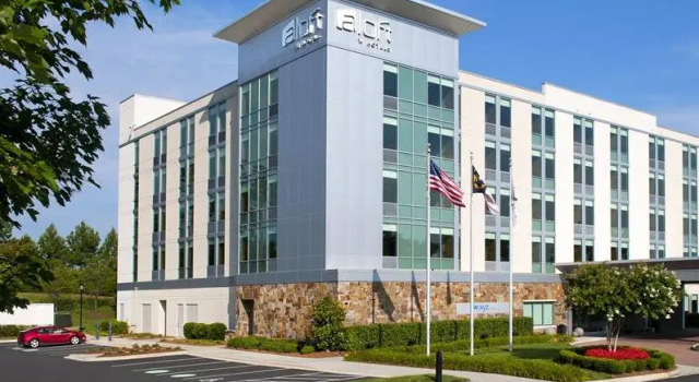 Кровать в общем номере Aloft by Marriott Charlotte Ballantyne
