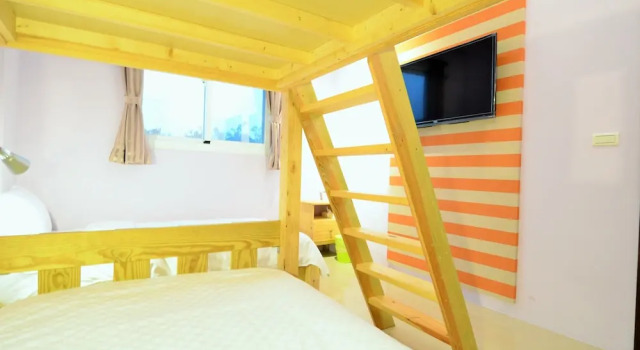 Кровать в общем номере I'm Here B&B-Peng's family