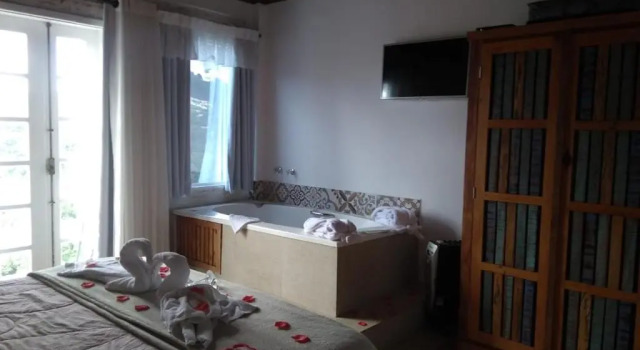 Номер Deluxe Pousada Casa Pinha em Campos do Jordão