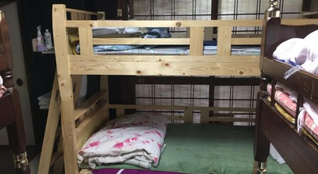 Кровать в общем номере International Guest House Tani House