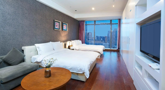 Семейный номер Deluxe Grand Madison Qingdao Harbour-view Central（Former Qingdao Farglory Hotel）