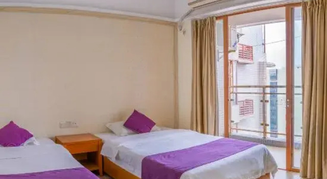Кровать в общем номере с 3 комнатами с частичным видом на море Fengfan Resort Apartment (Zhapo Dajiaowan Water Park)
