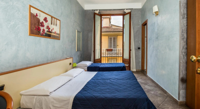 Кровать в общем номере Hotel Angelica Firenze