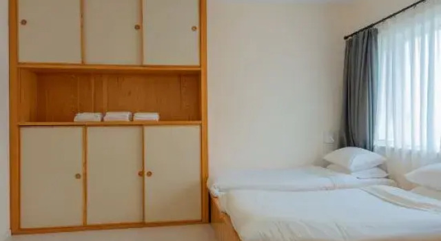 Кровать в общем номере Shuguo Jule Xinglv Hostel
