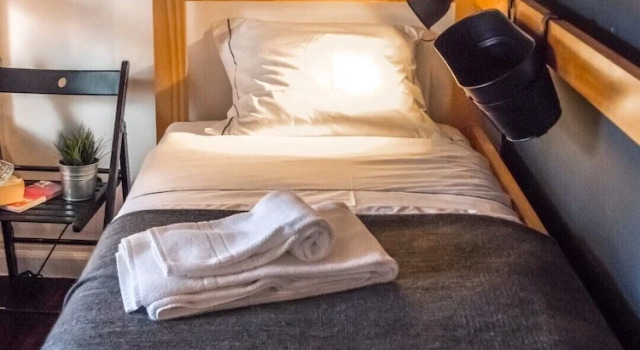 Postel ve společném pokoji Procyon Boutique & Suites