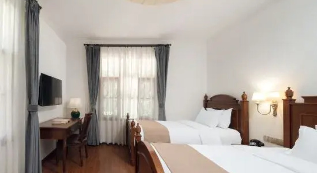 Семейный люкс с балконом и с видом на сад Gulangyu Chuncao Fragrance Seaview Villa (Sanqiutian Wharf Branch)