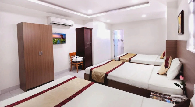 Кровать в общем номере Arise Hotel