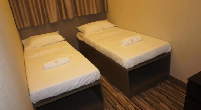 Кровать в общем номере (мужской номер) Homy Inn North Point