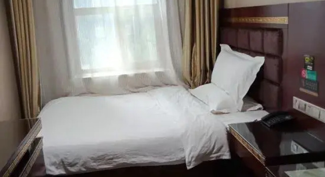 Номер Deluxe Xining Julong Business Hotel (Xining Railway Station Provincial Hospital)
