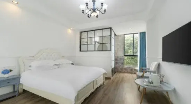 Кровать в общем номере с 6 комнатами Suzhou Xunmi Banshan Homestay