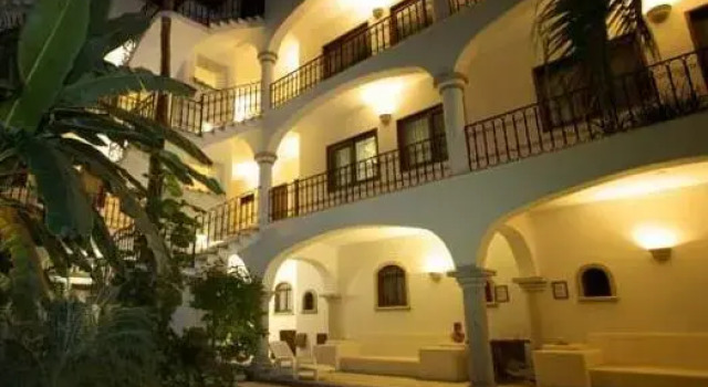 Кровать в общем номере Fabiola Condo Hotel